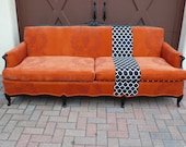 Orange French Provincial couch sofa with black and white geometric stripe