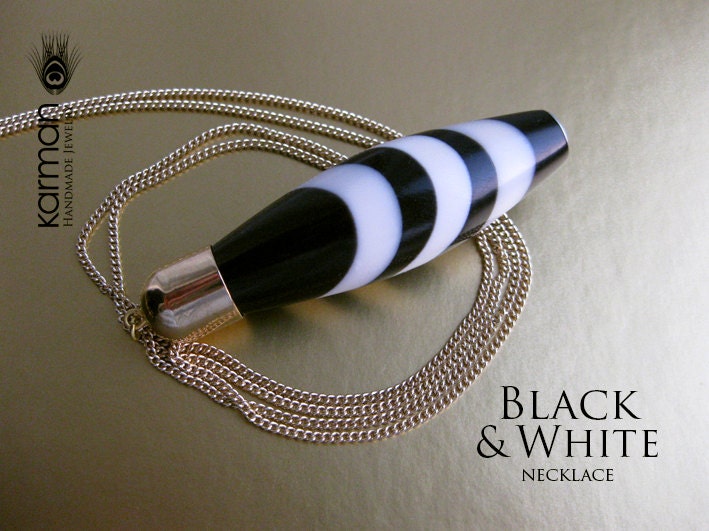 Black and White Pendant Necklace on gold toned chain.