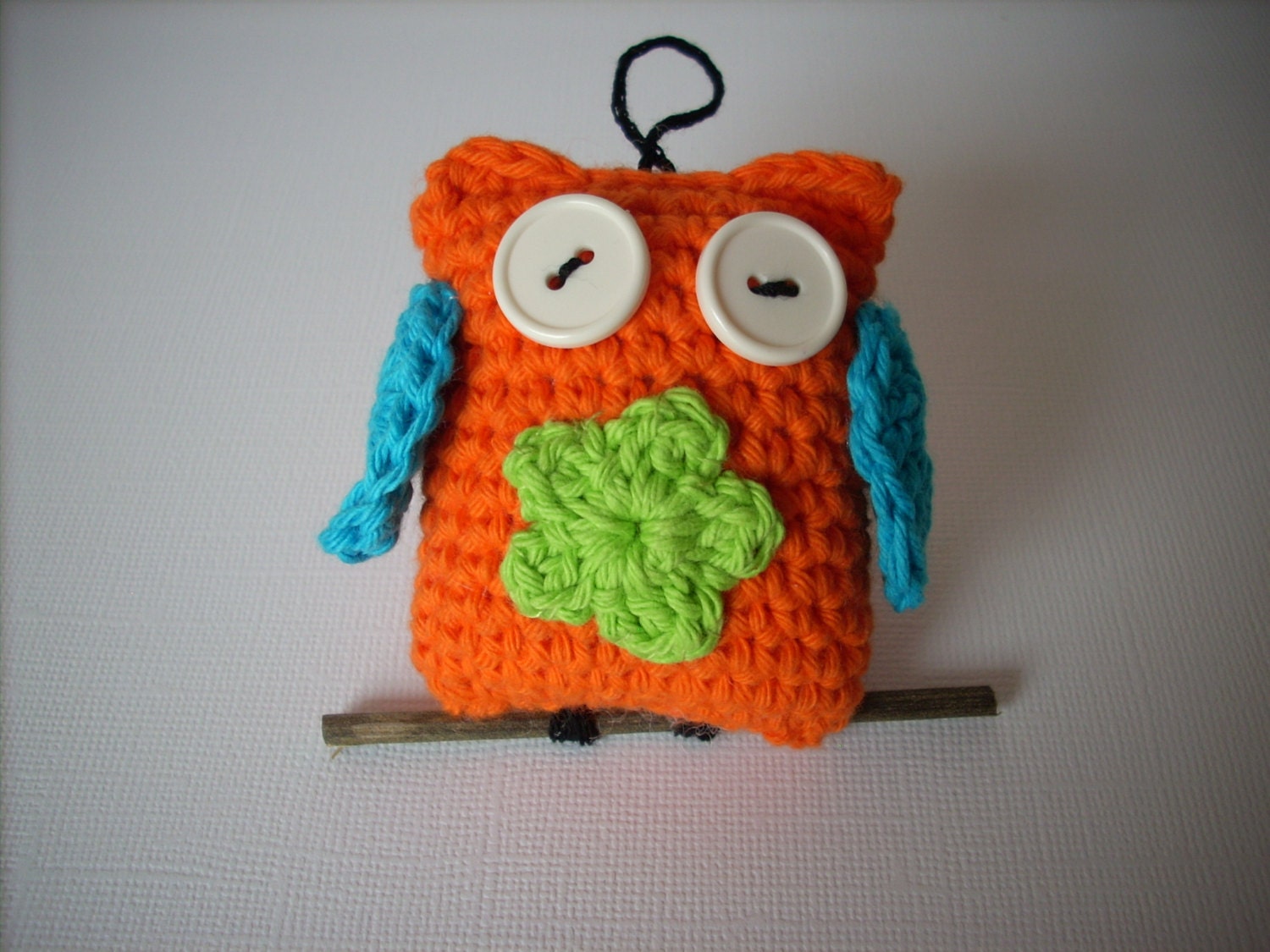 Crocheted owl  bright orange with crocheted flower