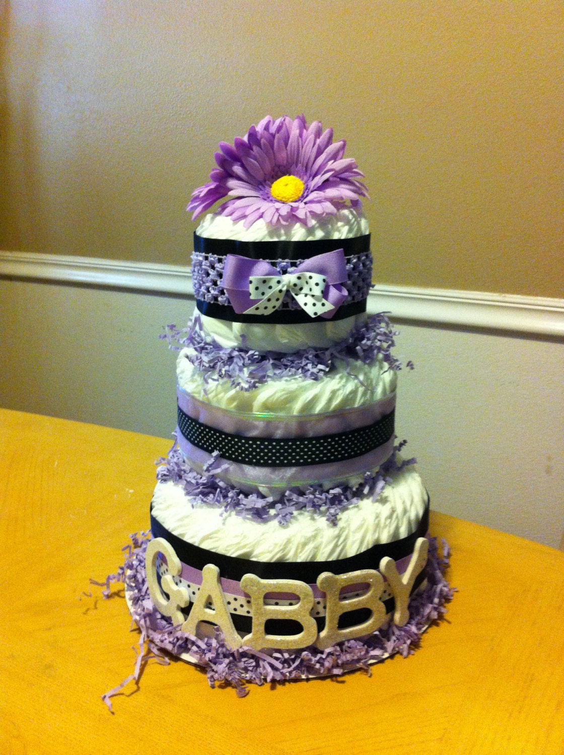 purple black and white diaper cake