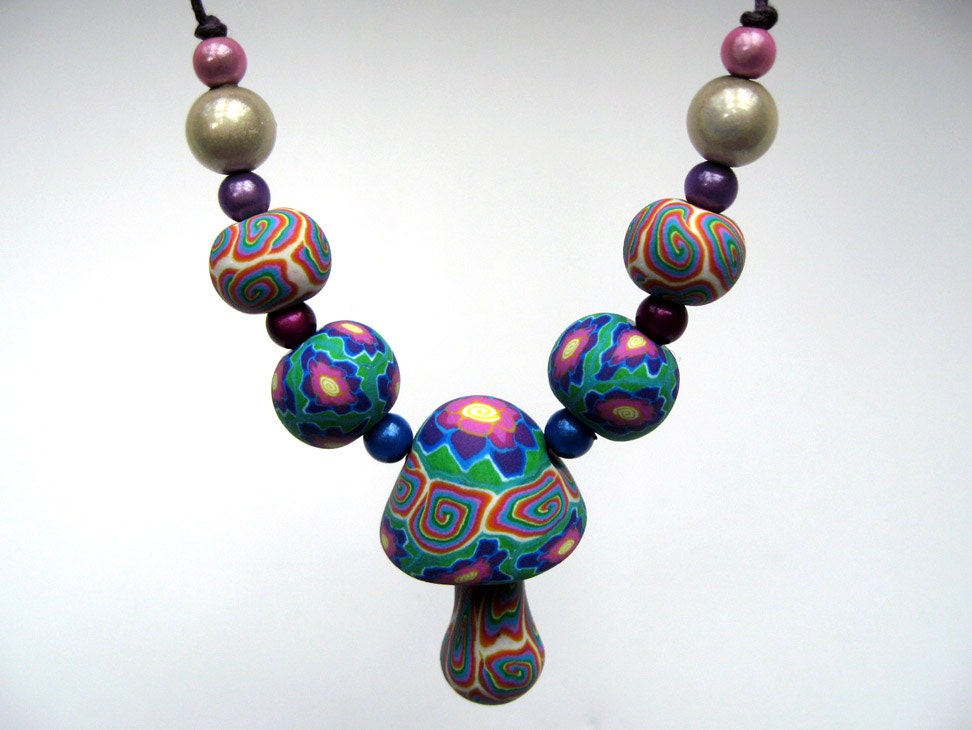 Handmade millefiori mushroom necklace in pink, purple, turquoise, blue and cream. polymer clay with flower and spiral patterns