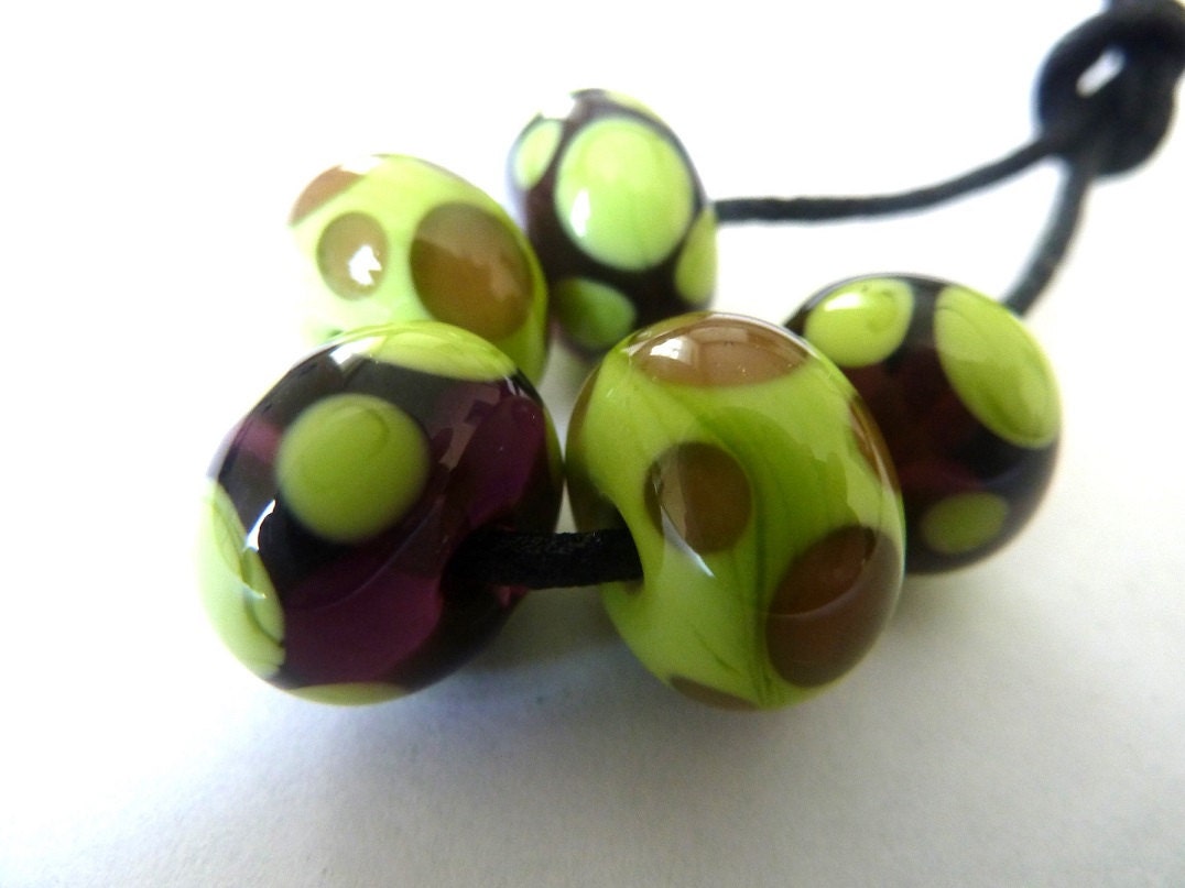 handmade lampwork glass beads, purple and green spots