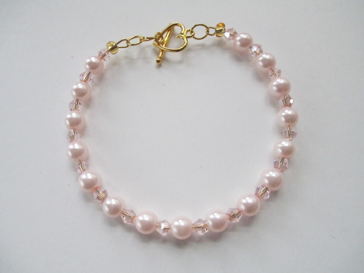 Handmade Jewelry beaded pink crystal and pearl bracelet with gold tone heart toggle clasp