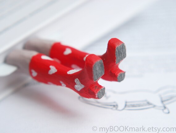 Legs in the book. Red boots with white hearts for her. Funny St. Valentines day gift. Valentine