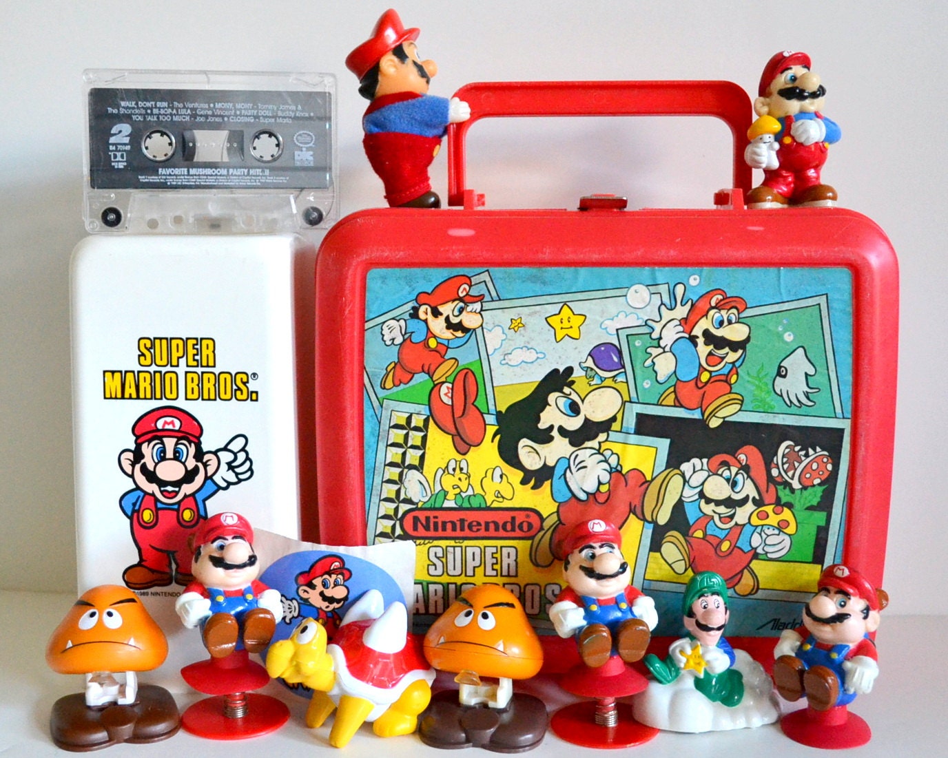 Vintage Super Mario Bros Lot. Lunchbox, Figures, Cup Dispenser, Cassette Tape, Sticker. Instant Collection Original 80s Nintendo Collectible