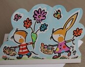 Easter basket carriers is a handmade watercolour painted card featuring a rabbit and mouse carrying easter egg baskets and flowers.