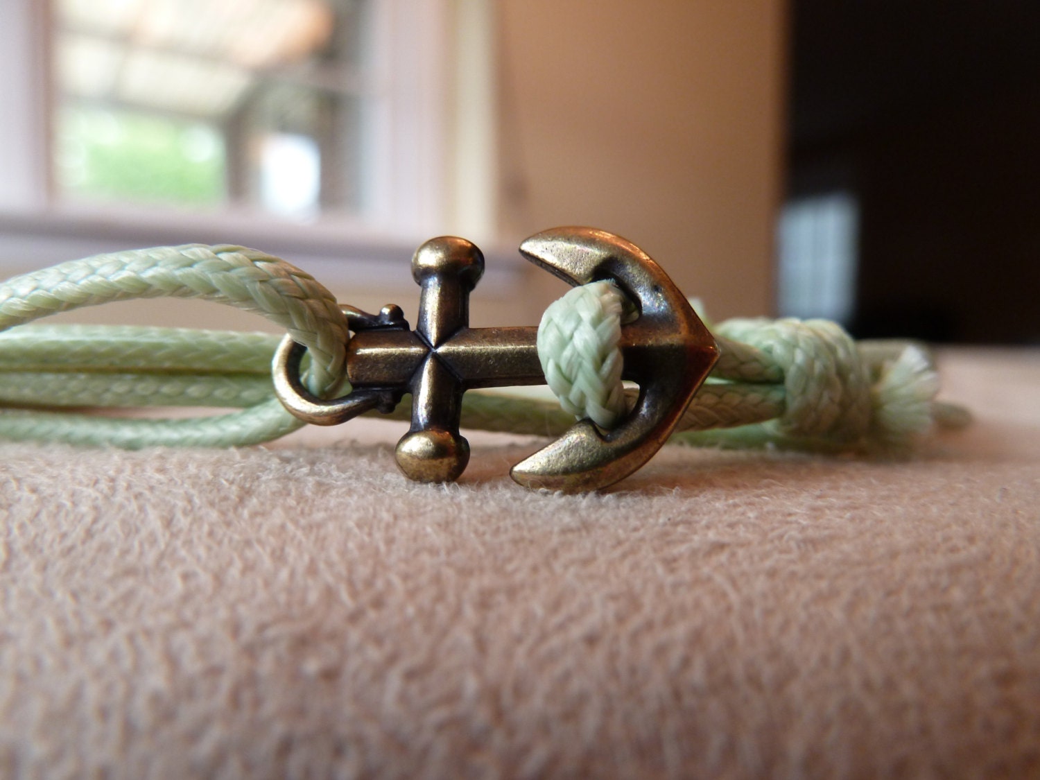Light Green Woven Waxed Cotton Cord Wrap Bracelet with an Antique Brass Anchor featuring adjustable slip knot