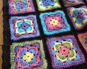 Crocheted afghan kaleidoscope of colors with black border READY TO SHIP