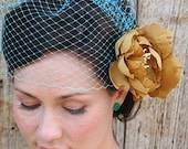 Josephine - turquoise birdcage veil paired with double golden silk flower head piece