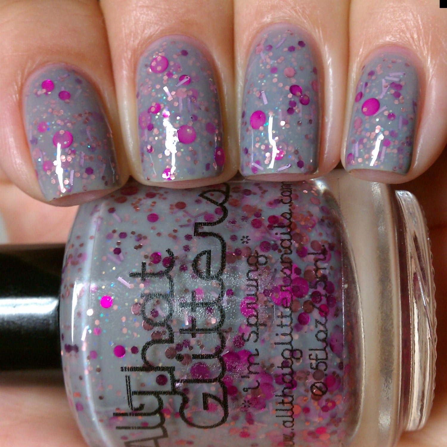 I'm Sprung - grey creme base with light pink, fuchsia dot and iridescent glitter nail polish