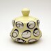 Yellow Porcelain Lidded Jar with White and Black Circles