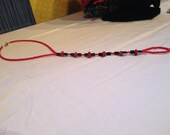 Black and red ankle-toe anklet