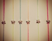 Silver star bead on a fluorescent variegated silk thread wish or friendship bracelet/anklet