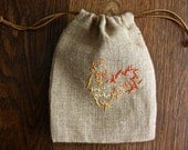 Burlap weaved gift bag with one of a kind embroidery and leather strings
