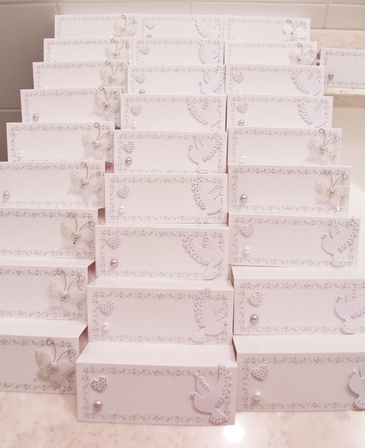 28 Seating placement name cards butterflies and white pearls - wedding favours - table decorations - name cards