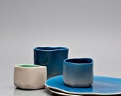 Delicate stonewear drinking cup -- with transparent glaze for a natural clay color.