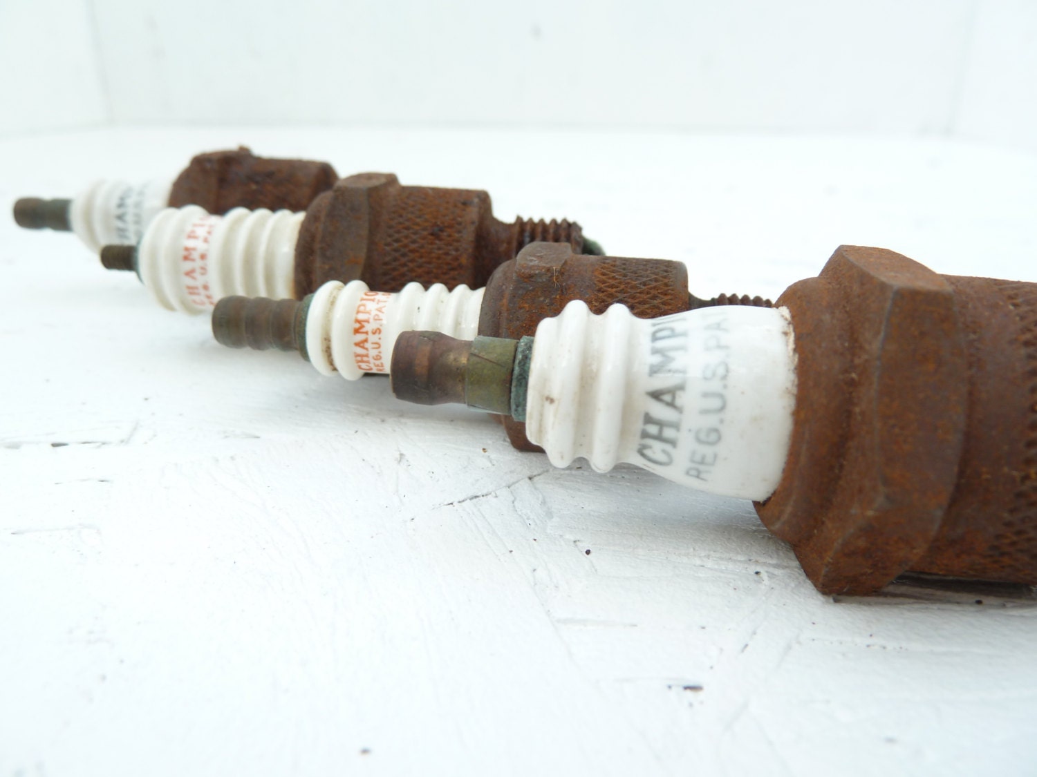 Champion USA Spark Plugs, Toledo, Ohio, metal and ceramic, antique art supply or garage decor