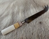 Cheese knife with a handmade reindeer antler and curley birch handle. presented in a gift box.