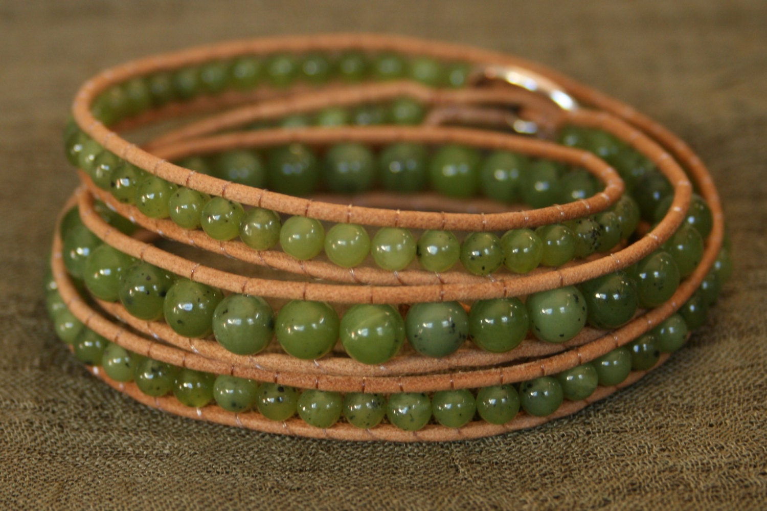 Jade, Sterling Silver, Triple Wrap Leather Beaded Bracelet.  Semiprecious Green Jade beads, sterling button.