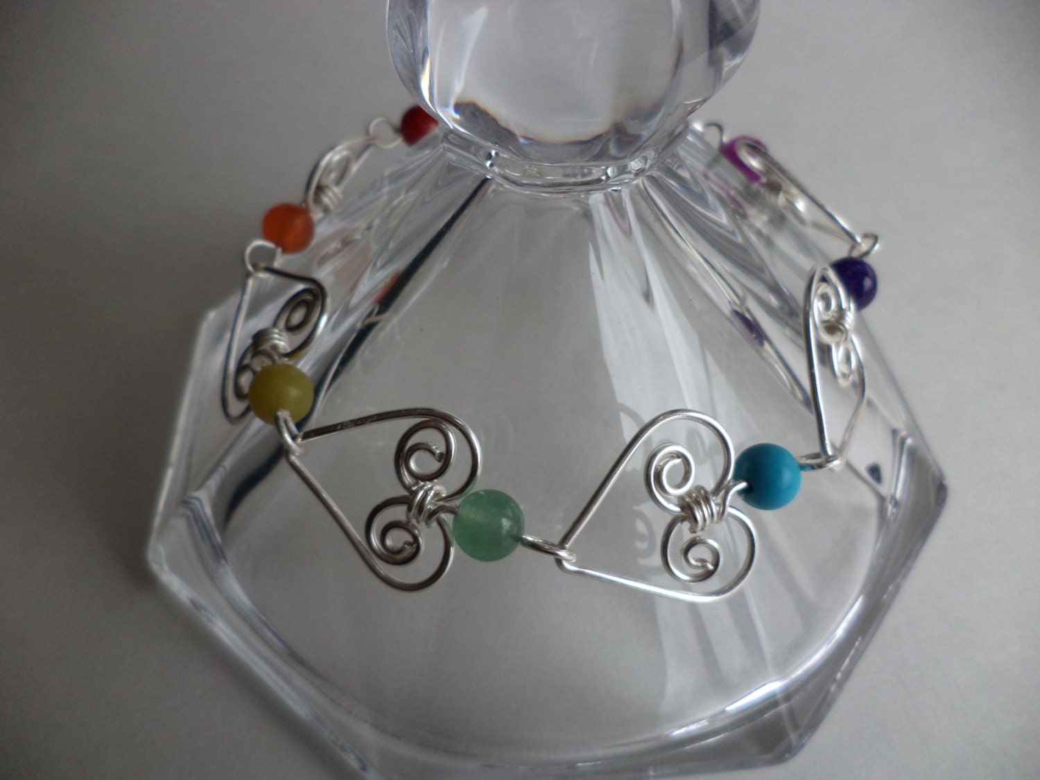 Seven Chakras bracelet, wire wrapped, gemstones beads, silver plated wire, handmade by Iris Jewelry Creations.