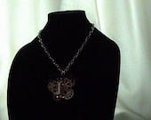 Steampunk or Dieselpunk Gear, Key and Latice tied with ribbon and bow on a chain necklace