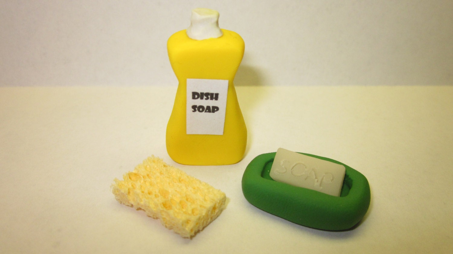 Dish soap, sponge, bar of hand soap and dish