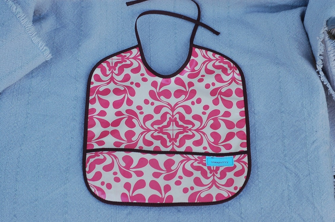 Coral Laminated Cotton Pocket Bib - handmade, baby, infant, toddler, feeding, girl, pink, brown