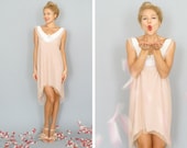 Paris: Mod A-line blush pink sheath dress with high low hem and pearl applique...