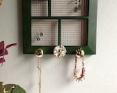 Upcycled green wood frame jewelry holder with decorative gold tone knobs - perfect for St. Patrick's Day