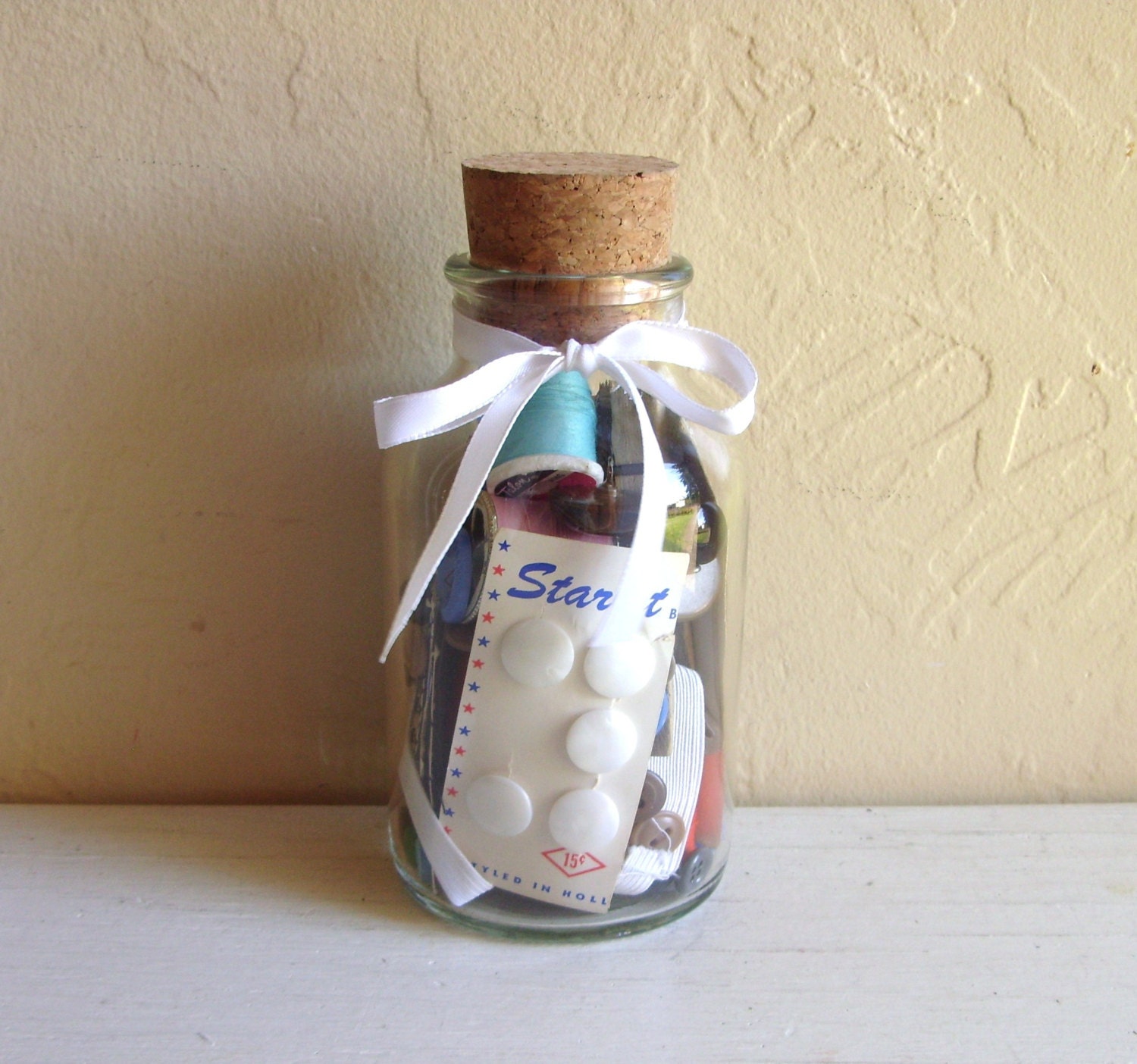 Corked Glass Jar Full of Vintage Sewing Notions Thread Buttons and More