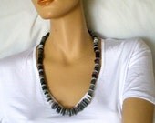 Long button necklace handmade with vintage grey trouser buttons and silvery beads.