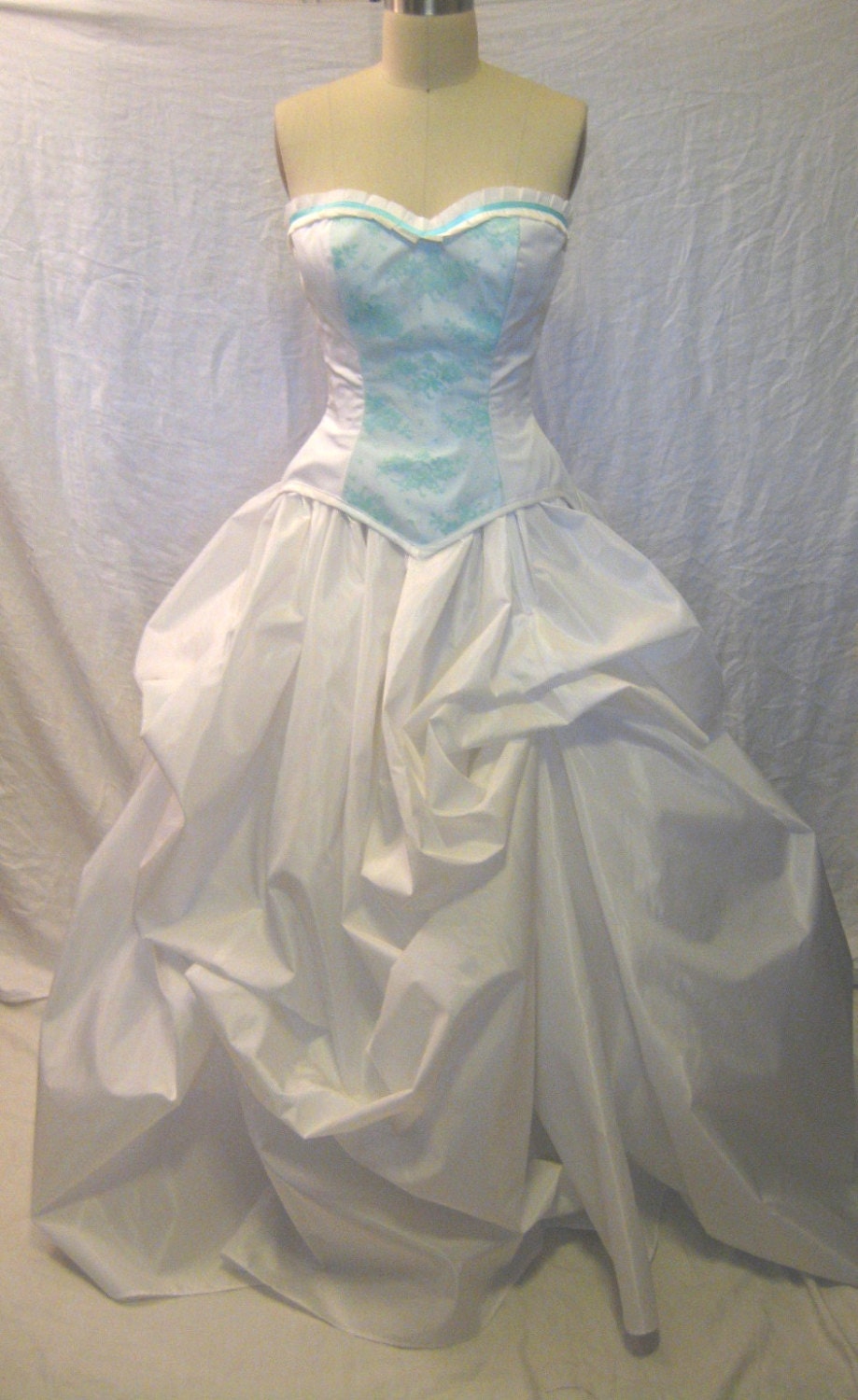 The Secret Boutique Rachael Bridal Bustle Gown in White with hand dyed aqua lace