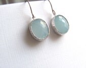 Light blue oval drop earrings, faceted glass in silver frames on sterling silver plated fixtures
