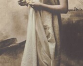 Maiden with Golden Hair Ribbon and Draped in Classical Fashion, circa 1900