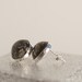 eco resin stud earrings - black resin and metallic silver leaf flakes - silver settings