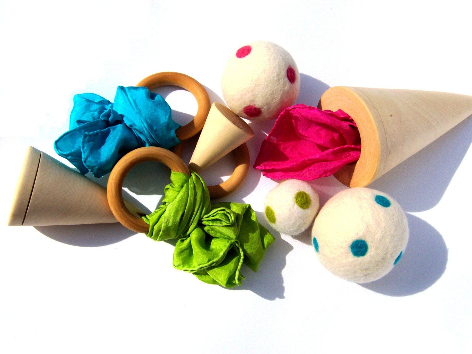 Favorite Toy: Montessori and Waldorf Inspired cones, balls, rings, and silks (wood, wool, and silk) in lime, fuchsia, and  turquoise