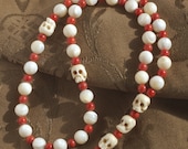 Three Decade Mother of Pearl and Coral Rosary with Skulls