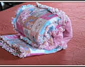 Pink flannel rag quilt with bears and flowers