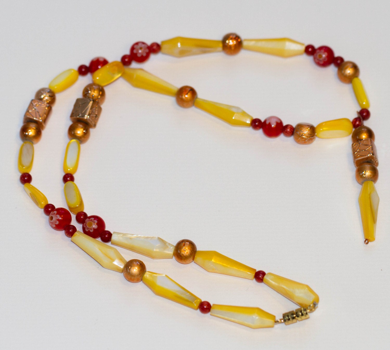 A Warmer Side: Yellow, copper and red beaded necklace with beaded pendant