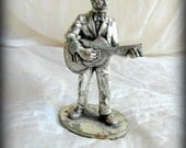 Discount on multiple buys. Vintage rock n roll figurine metal chrome.