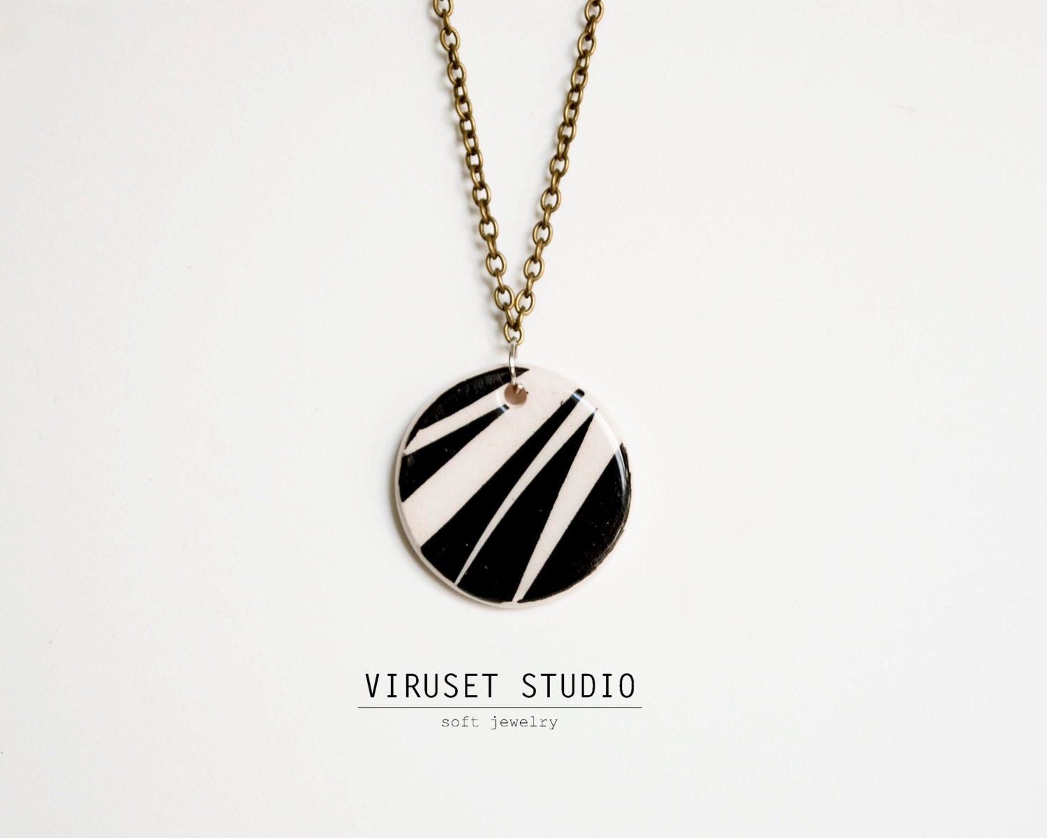 Black and white ceramic small necklace safari inspiration completely handmade by Viruset Studio Ceramic jewelry
