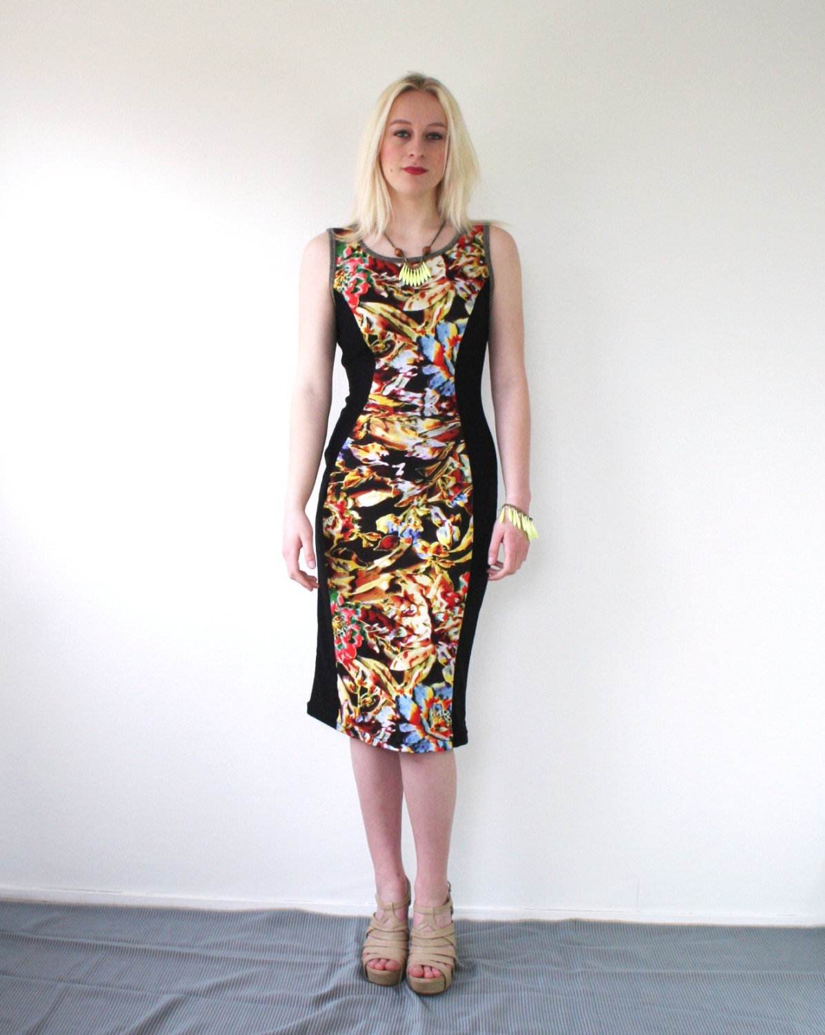 KAJKA floral dress, body con knee length dress, abstract print in yellow red green blue, bold black and glitter detail, women's fashion