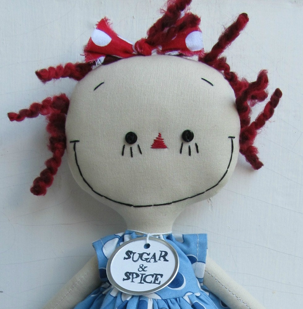 handmade cloth doll Raggedy Ann in a Blue Polka Dot Dress with Red striped tights and shoes