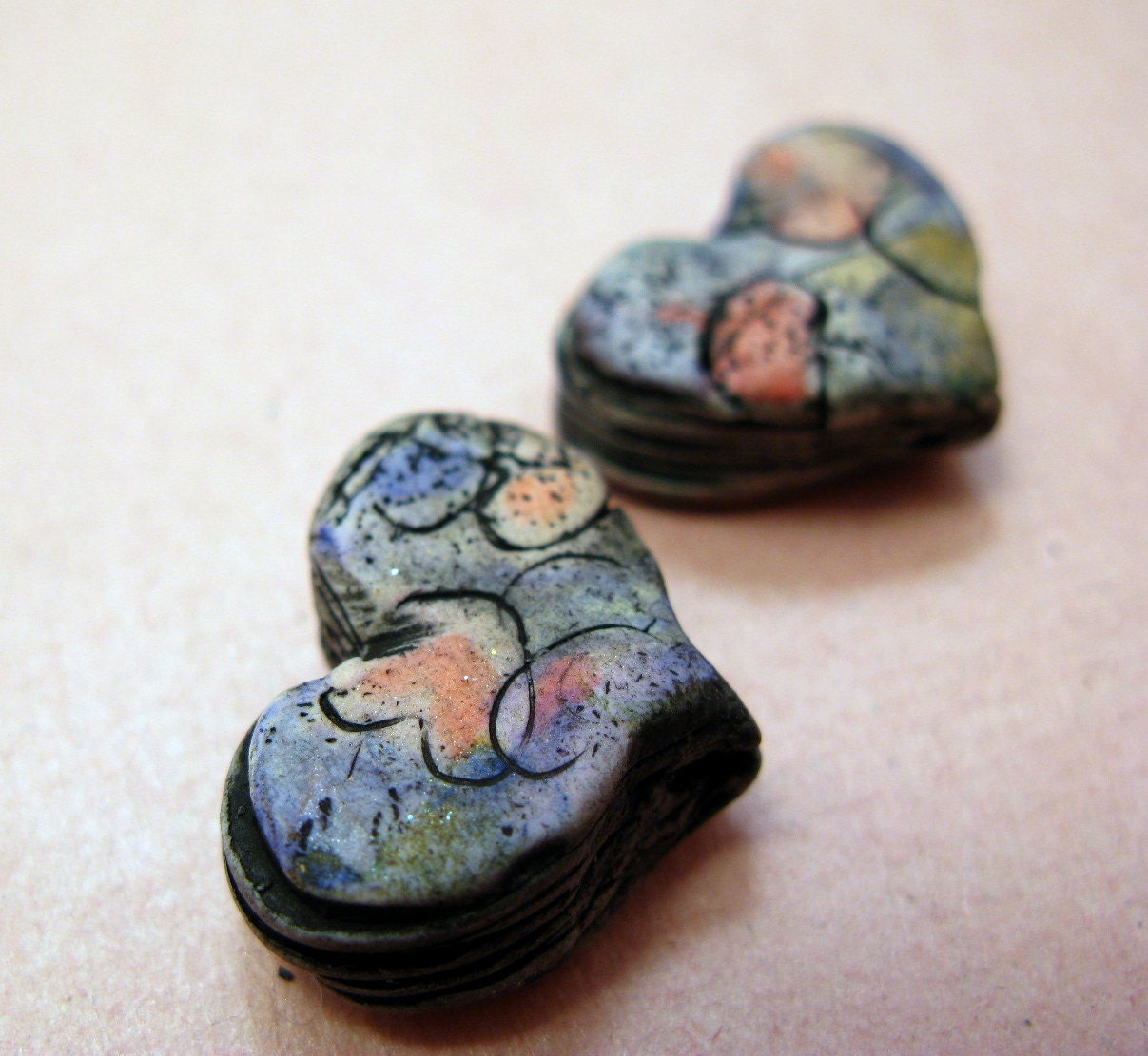 Heart on heart colorful strata beads in polymer clay with pink and periwinkle accents