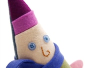 Plush doll elf named Antonio, wool and felt gnome wearing a purple hat and blue scarf
