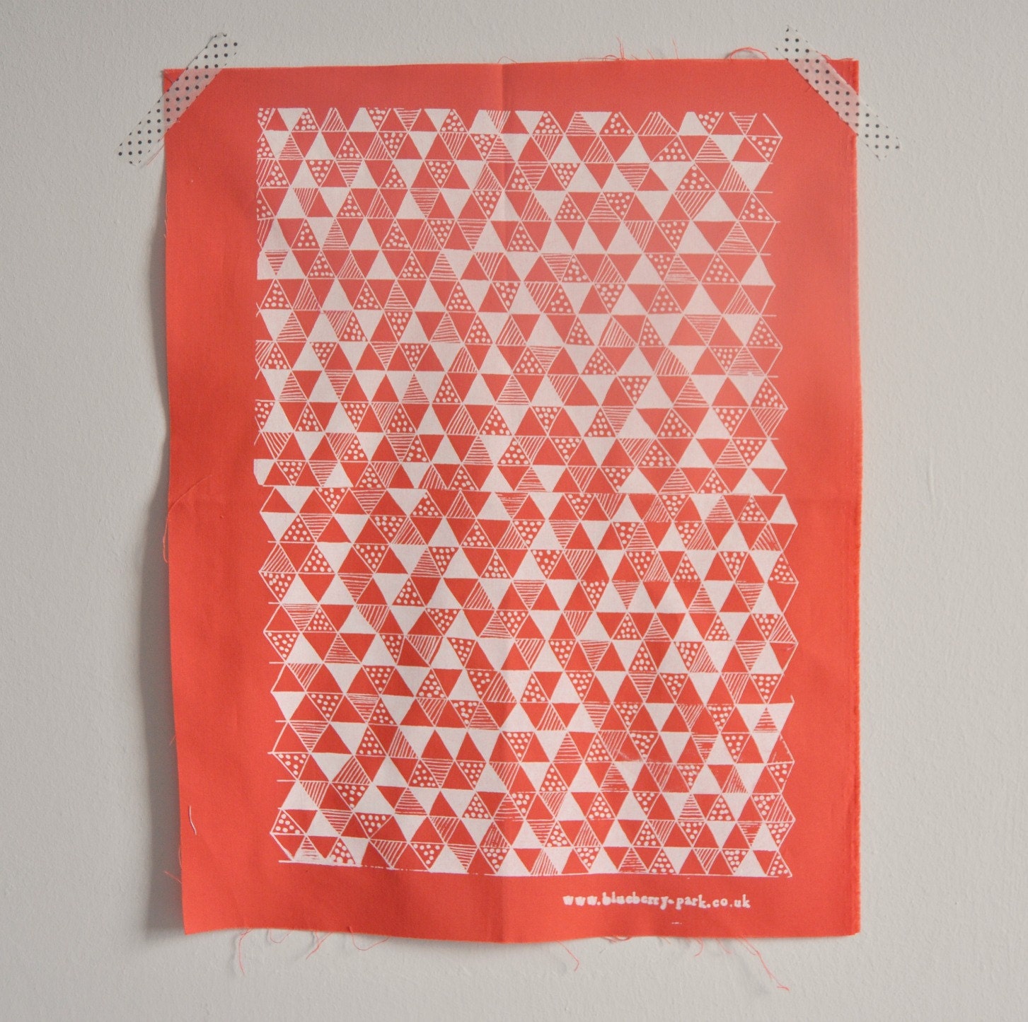 White on coral Triangle Mania screen printed fabric