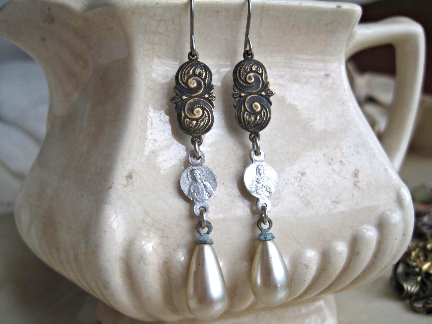 shabby chic pearl drop religious earrings with vintage sacred medals.