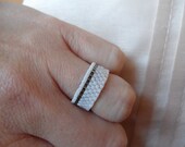 White and silver beaded ring.
