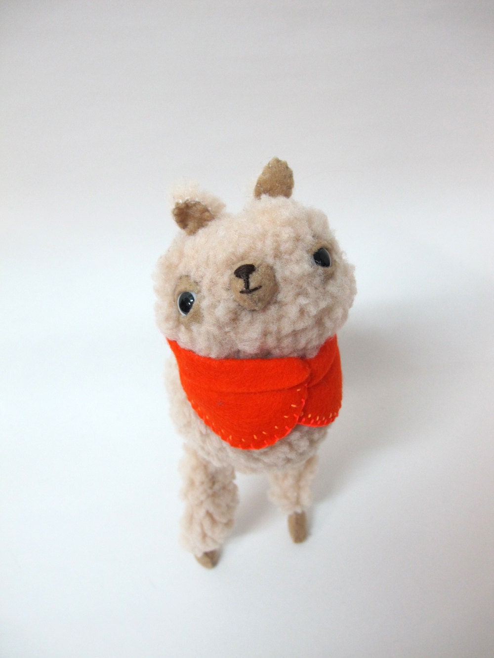 Small Wooly Alpaca in an Orange Embroidered Cape