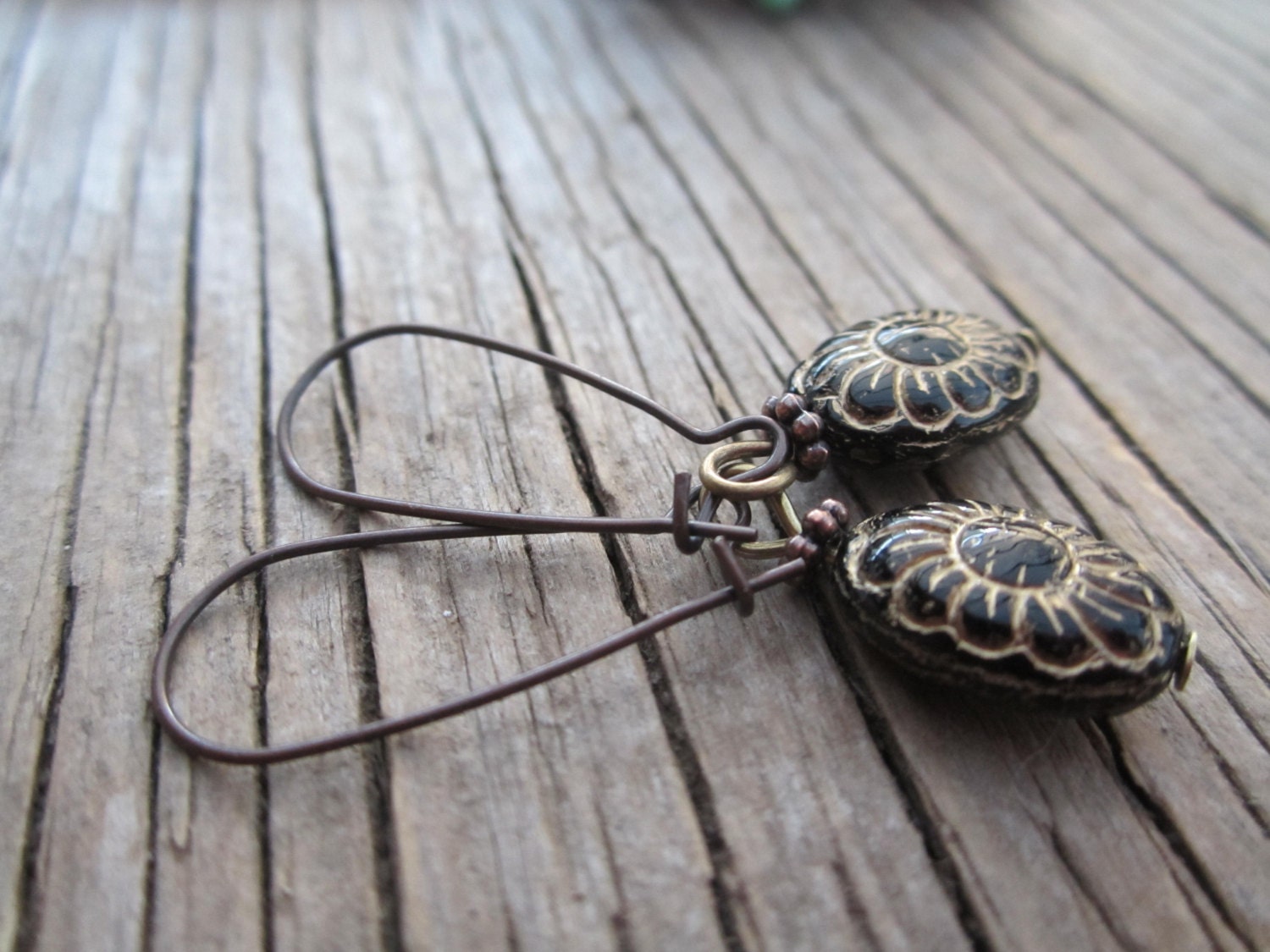 Gorgeous carved black and gold earrings,antique looking, on long ear wires